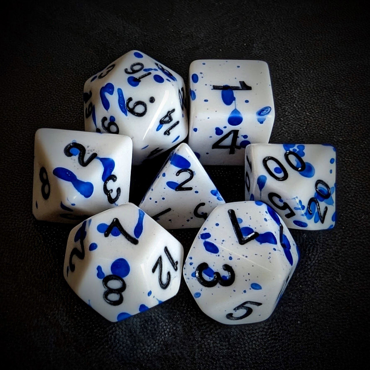 Blue Blood Splatter on White Acrylic - 7pcs RPG Full Dice Set Top