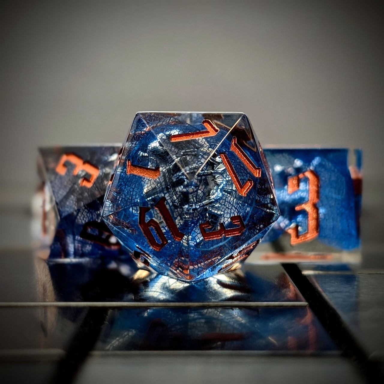 Spider in Clear & Blue Filled Sharp Resin - 7pcs RPG Dice Set