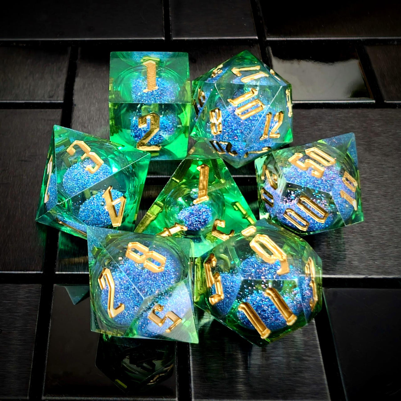 Blue Glitter in Green & Clear Liquid Filled Sharp Resin - 7pcs RPG Dice Set
