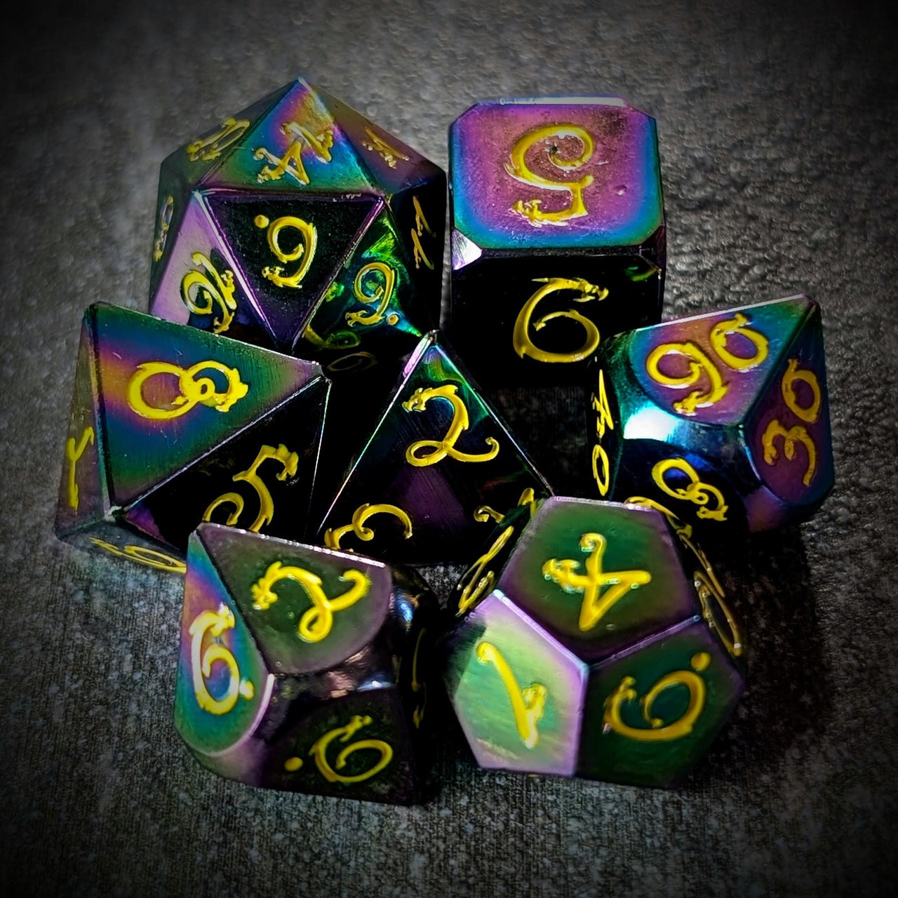 Rainbow Metal with Yellow Dragon Font - 7pcs RPG Dice Set
