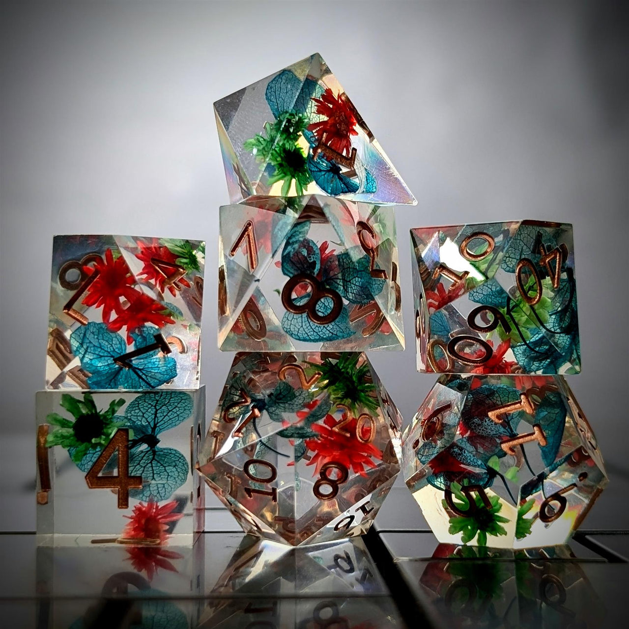 Red, Blue & Green Flowers in Clear Filled Sharp Resin - 7pcs RPG Dice Set
