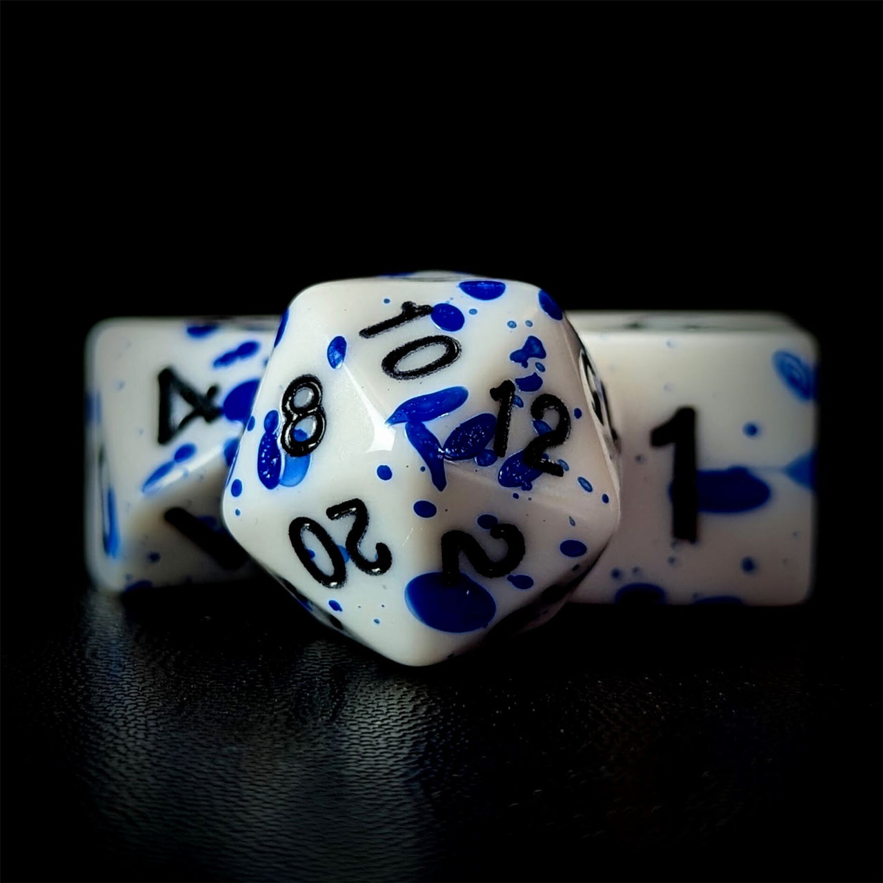 Blue Blood Splatter on White Acrylic - 7pcs RPG Full Dice Set Close