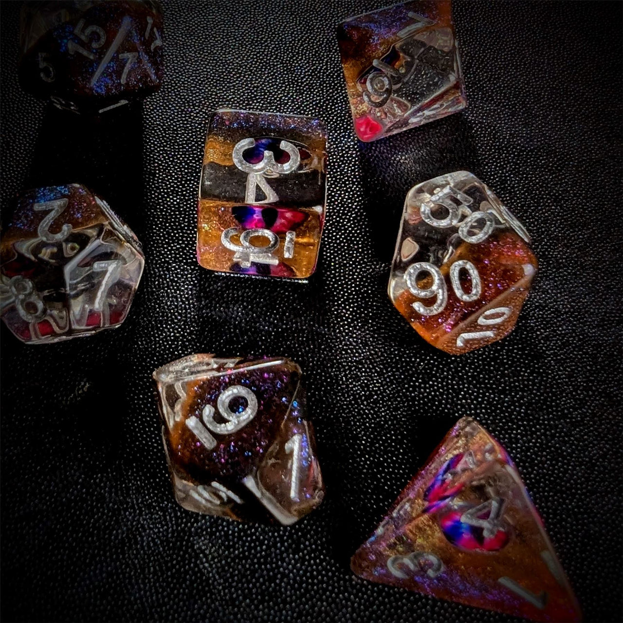 Demon Eye in Clear & Orange & Blue Resin - 7pcs RPG Full Dice Set