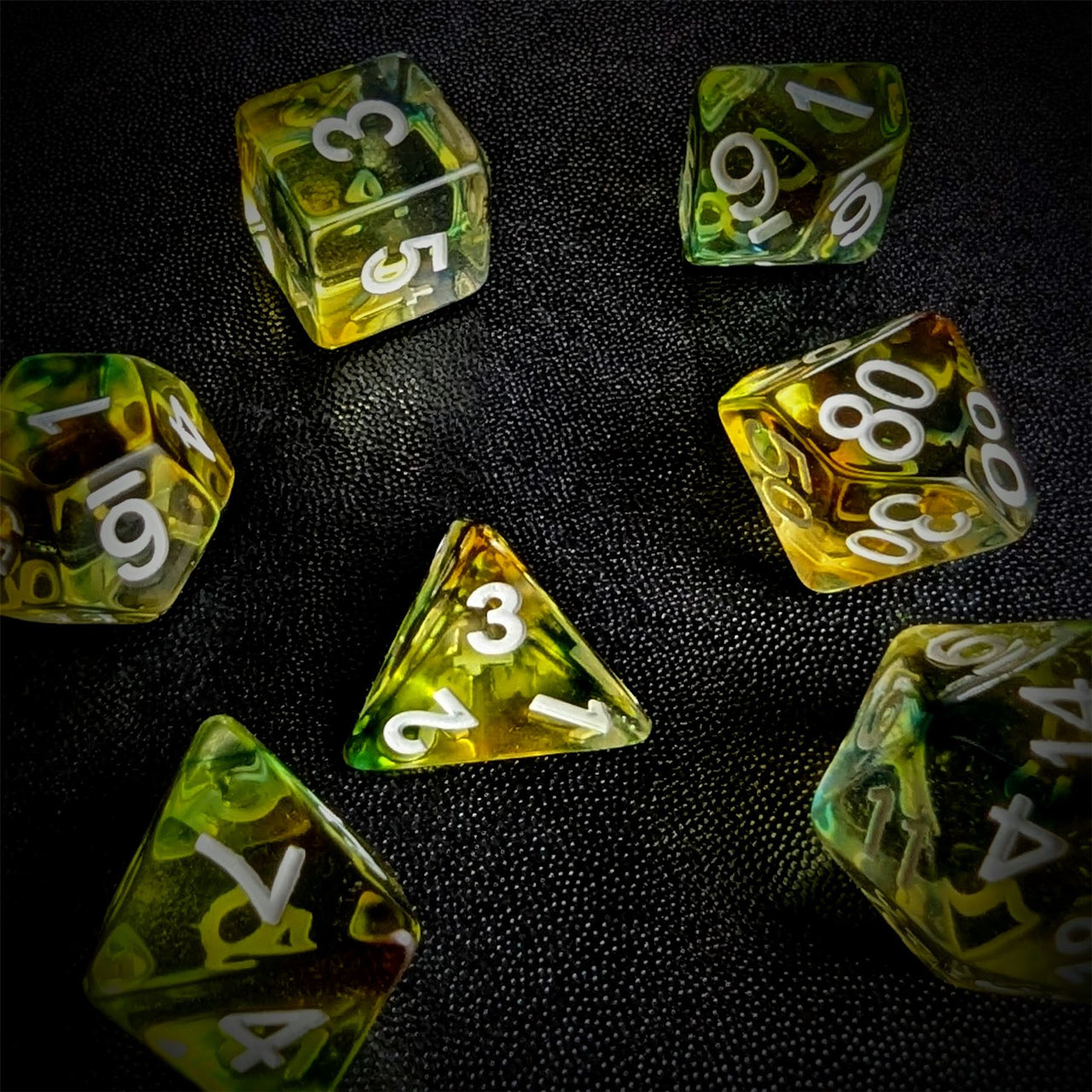 Yellow & Black with Blue Swirl in Clear Resin - 7pcs RPG Full Dice Set