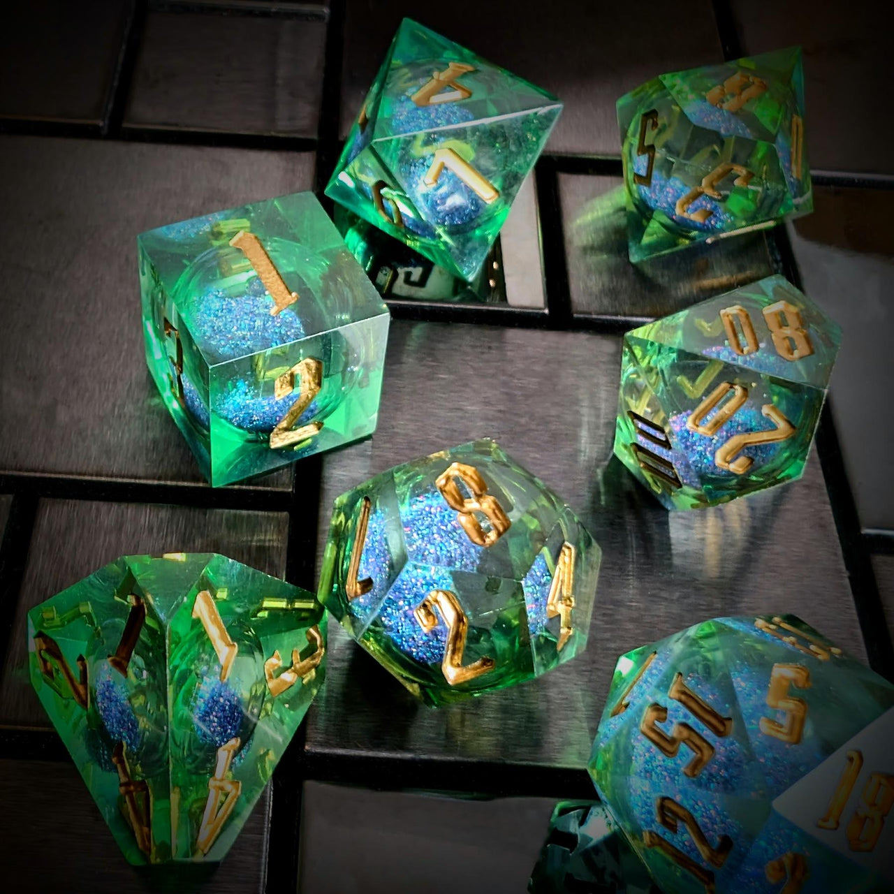 Blue Glitter in Green & Clear Liquid Filled Sharp Resin - 7pcs RPG Dice Set
