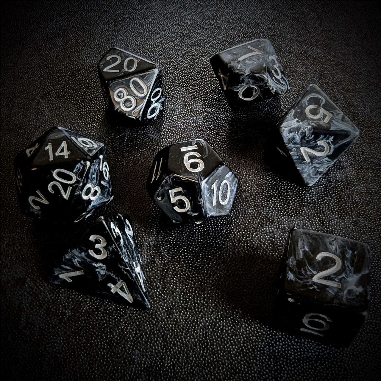 White Swirl in Black Resin - 7pcs RPG Full Dice Set