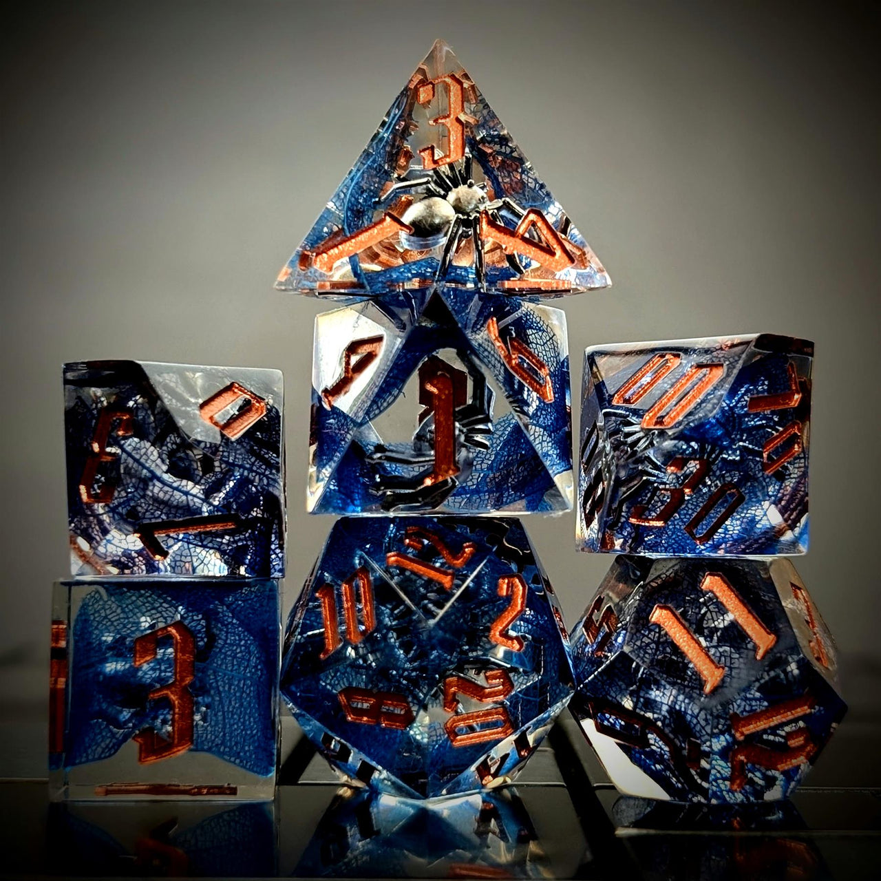 Spider in Clear & Blue Filled Sharp Resin - 7pcs RPG Dice Set