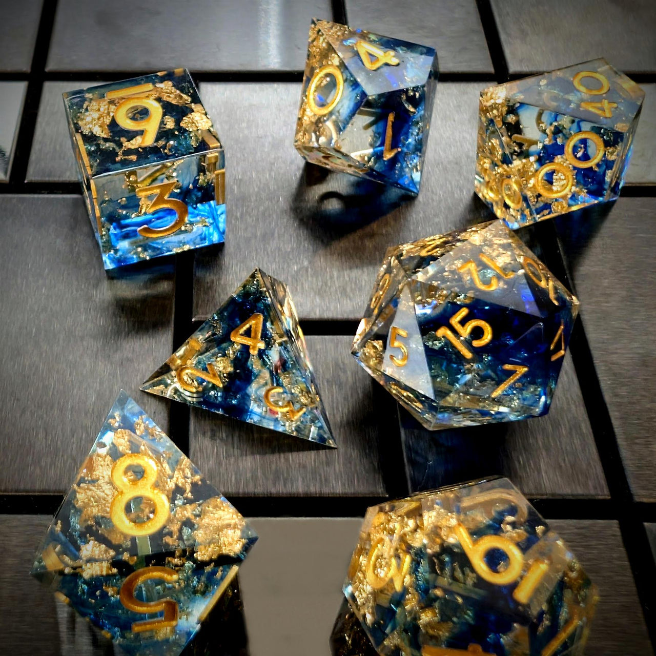 Blue Swirl in Clear with Gold Foil Sharp Resin - 7pcs RPG Dice Set