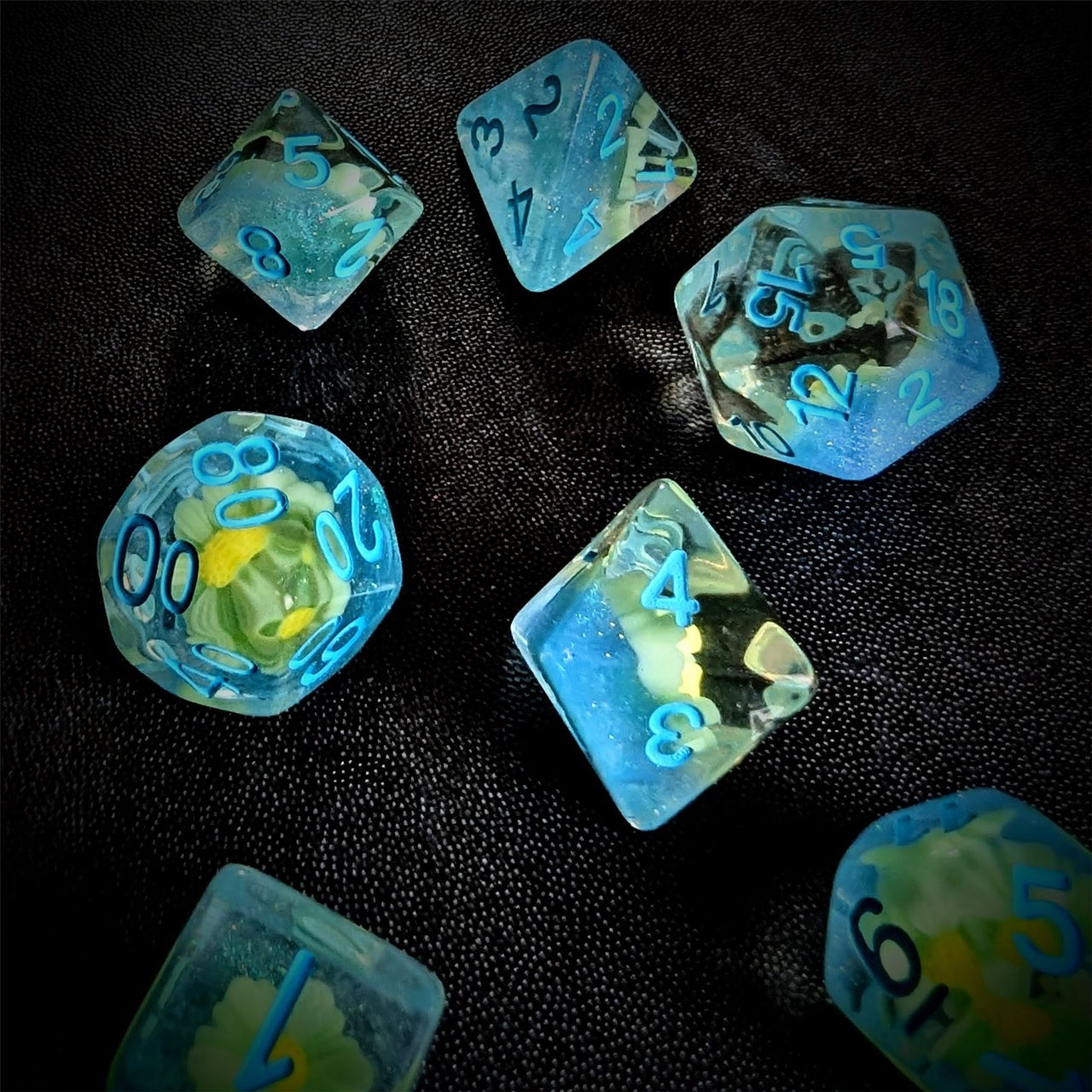 White Flowers in Clear & Blue Resin - 7pcs RPG Full Dice Set