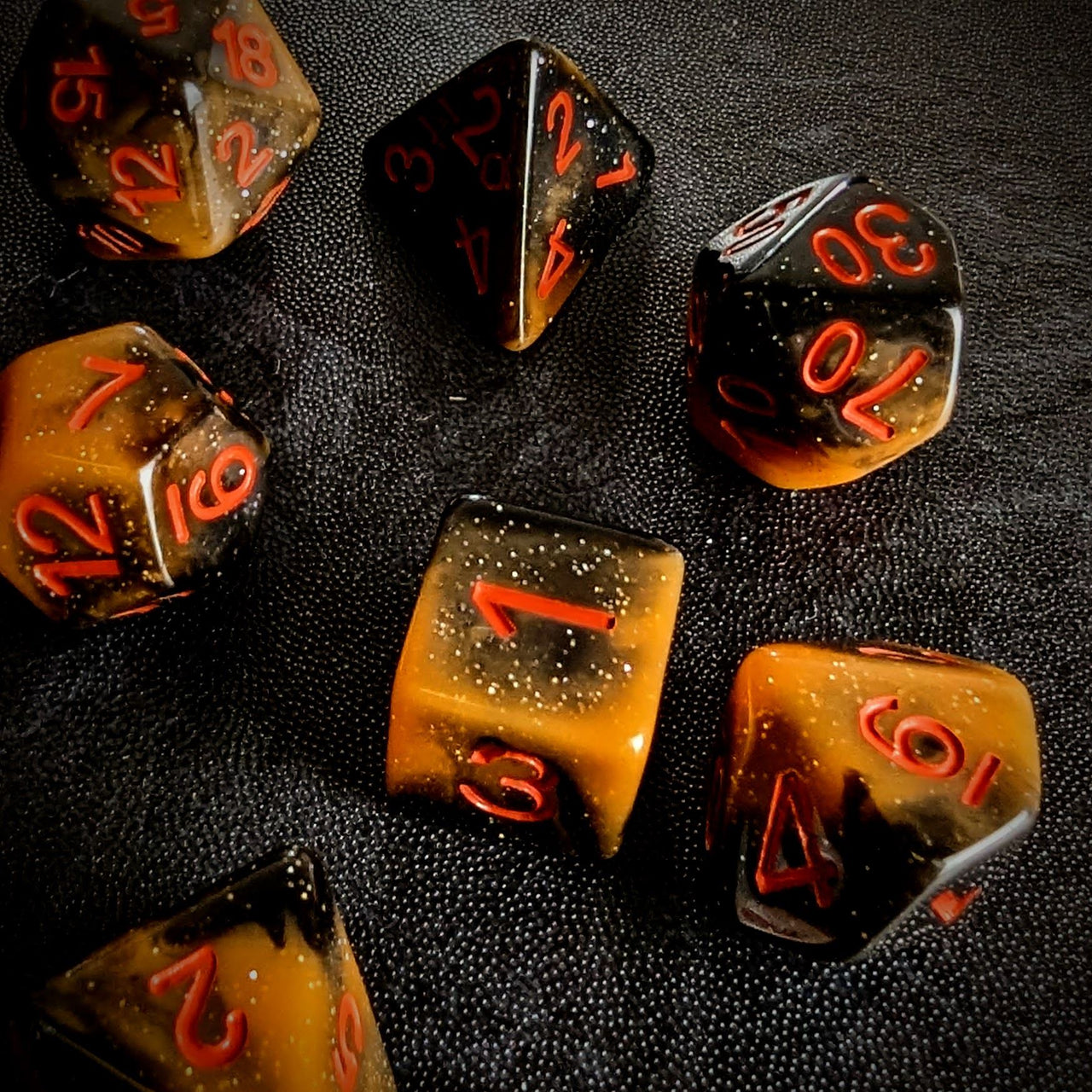 Glitter in Black & Orange Acrylic - 7pcs RPG Full Dice Set Scatter