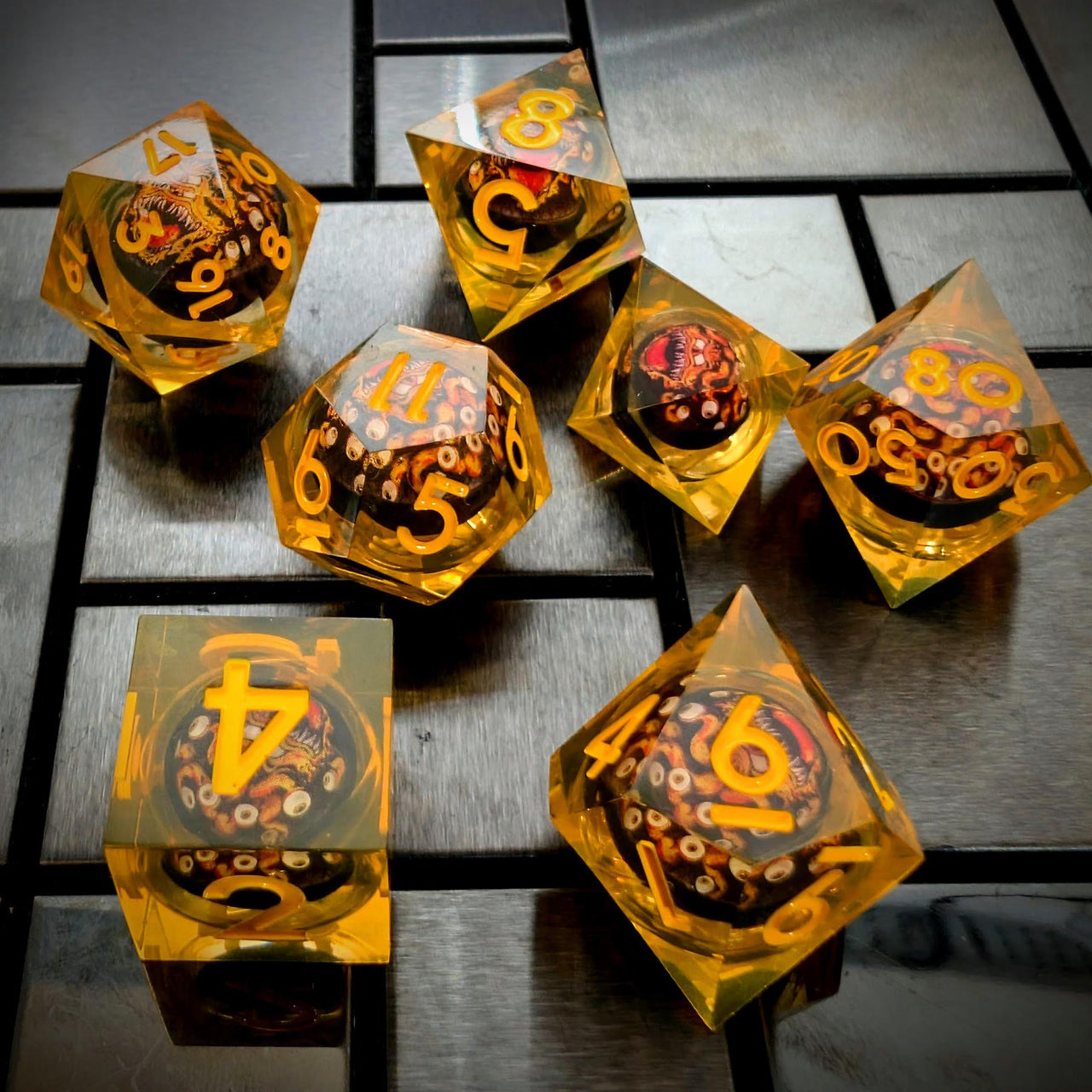 Orange Beholder in Orange & Clear Liquid Filled Sharp Resin - 7pcs RPG Dice Set